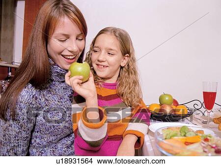 Picture - breakfast table, dining, daughter, 7-8 years. Fotosearch
