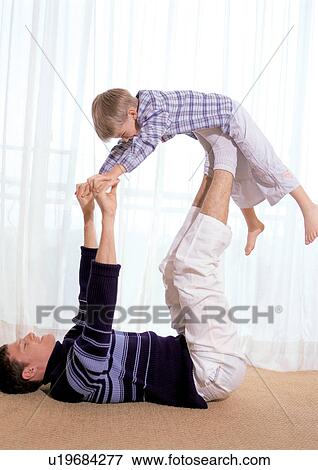 child, carrying on legs, mid adult man, 4-5 years View Large Photo Image Stock Photo - child, carrying on legs, mid adult man, 4-5 years. Fotosearch