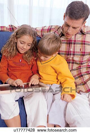 father with children, black board, education, young boy, 4-5 years, sitting View Large Photo Image Stock Photo - father with children, black board, education, young boy, 4-5 years, sitting. Fotosearch