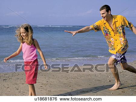 Stock Photograph - father, with families, water, father with child, sand, joy, culture. Fotosearch