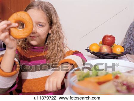 indoor, childhood, food and drink, young girl, head and shoulders, eating View Large Photo Image Stock Image - indoor, childhood, food and drink, young girl, head and shoulders, eating. Fotosearch
