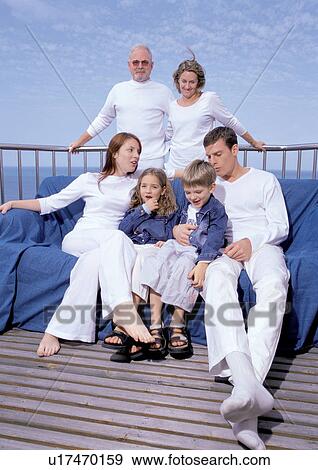 mid adult woman, grandfather, 7-8 years, sofa, daughter, 4-5 years, lifestyle View Large Photo Image Stock Photo - mid adult woman, grandfather, 7-8 years, sofa, daughter, 4-5 years, lifestyle. Fotosearch