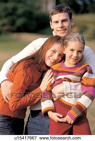young girl, happiness, mid adult woman, arms around, with families View Large Photo Image Stock Photo - young girl, happiness, mid adult woman, arms around, with families. Fotosearch