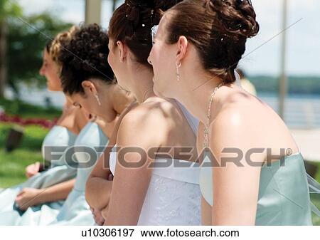 Stock Photo - Arms Crossed, Caucasian, Brown Hair, Bridesmaid, Adults Only. Fotosearch