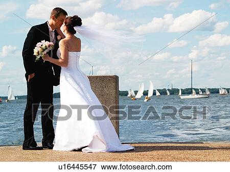 Holding, Standing, Face To Face View Large Photo Image Stock Photo - Holding, Standing, Face To Face. Fotosearch