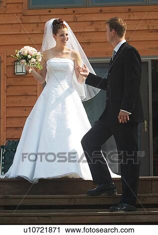Holding, Standing, Smiling View Large Photo Image Stock Image - Holding, Standing, Smiling. Fotosearch