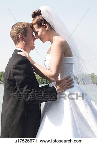 Holding, Standing, Smiling View Large Photo Image Stock Image - Holding, Standing, Smiling. Fotosearch