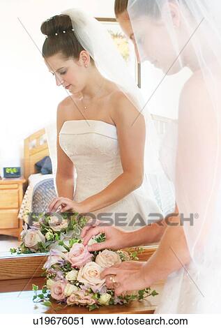 Stock Image - Holding, Standing, Wedding Dress. Fotosearch