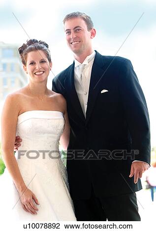 Stock Image - Standing, Smiling, Arm Around. Fotosearch