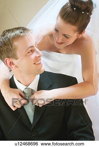 Stock Photograph - Standing, Smiling, Arm Around. Fotosearch