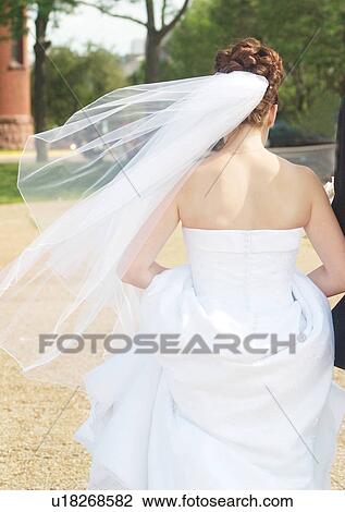 Stock Image - Walking, Wedding Dress, Veil. Fotosearch
