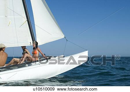 Stock Photo - Sail boating with beautiful woman . Fotosearch