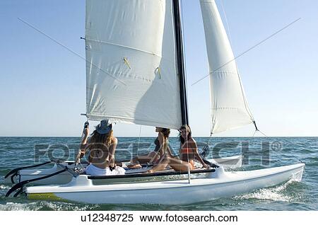 Women on a sailboat View Large Photo Image Stock Photography - Women on a sailboat. Fotosearch