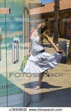Woman, Shopping, Casual wear, T shirt, Skirt, Sunglasses, Blond View Large Photo Image Stock Image - Woman, Shopping, Casual wear, T shirt, Skirt, Sunglasses, Blond. Fotosearch