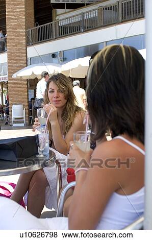 Stock Photo - Woman, Women, Shopping, Casual wear, T shirt, Skirt, Trousers. Fotosearch