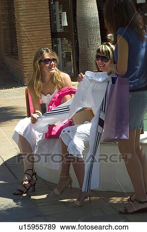 Stock Photo - Woman, Women, Shopping, Casual wear, T shirt, Skirt, Trousers. Fotosearch