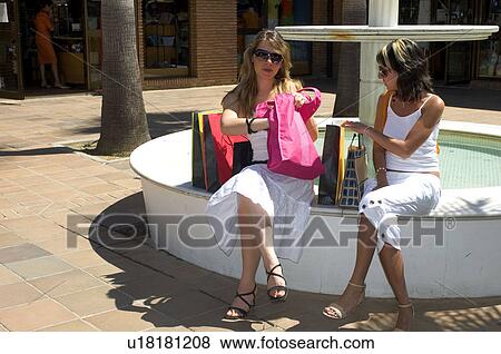 Stock Photo - Woman, Women, Shopping, Casual wear, T shirt, Skirt, Trousers. Fotosearch