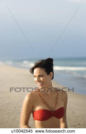 Caucasian mid-adult female smiling on beach in swimsuit. View Large Photo Image Stock Photography - Caucasian mid-adult female smiling on beach in swimsuit.. Fotosearch