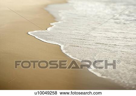 Stock Photo - Image of sandy beach with waves.. Fotosearch