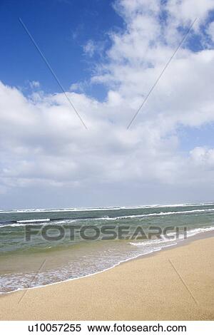 Stock Photography - Landscape of waves lapping on beach.. Fotosearch