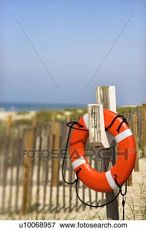 Life preserver hanging on post on Bald Head Island North Carolina View Large Photo Image Stock Photo - Life preserver hanging on post on Bald Head Island North Carolina. Fotosearch