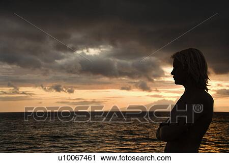 Male standing on the shore of Maui Hawaii USA View Large Photo Image Stock Image - Male standing on the shore of Maui Hawaii USA. Fotosearch