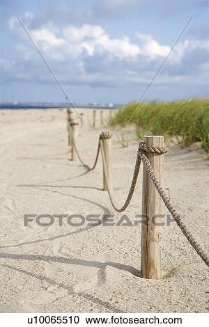 Rope fence barrier on beach. View Large Photo Image Stock Image - Rope fence barrier on beach.. Fotosearch
