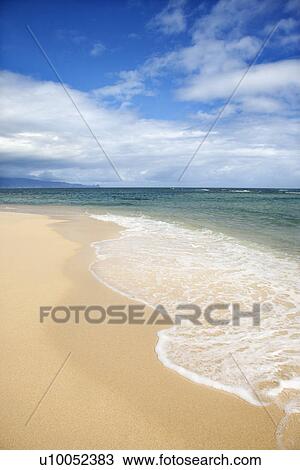 Tropical beach with wave receding from shore in Maui Hawaii, USA View Large Photo Image Stock Image - Tropical beach with wave receding from shore in Maui Hawaii, USA. Fotosearch