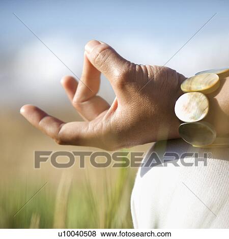 Close-up of young adult Asian female's hands in meditating position. View Large Photo Image Stock Photo - Close-up of young adult Asian female's hands in meditating position.. Fotosearch