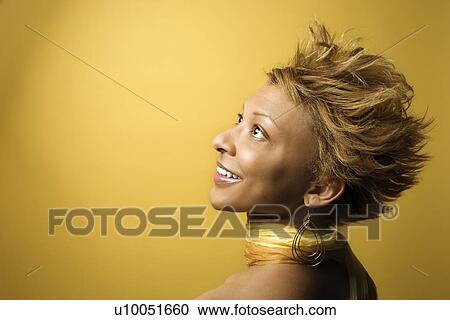 Side view portrait of smiling young African-American adult woman on yellow background. View Large Photo Image Stock Image - Side view portrait of smiling young African-American adult woman on yellow background.. Fotosearch