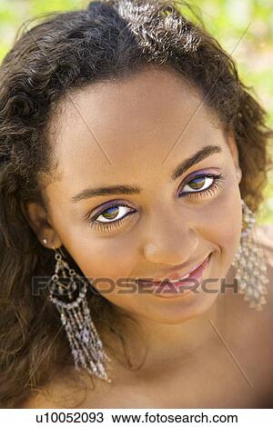 Young-adult Black woman making eye contact. View Large Photo Image Stock Image - Young-adult Black woman making eye contact. . Fotosearch