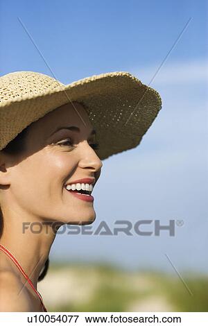 Caucasian mid-adult female in swimsuit and straw hat. View Large Photo Image Stock Photo - Caucasian mid-adult female in swimsuit and straw hat.. Fotosearch
