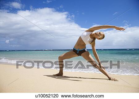 Caucasian young adult woman stretching on beach. View Large Photo Image Stock Image - Caucasian young adult woman stretching on beach.. Fotosearch