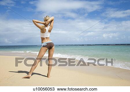Caucasian young adult woman stretching on beach. View Large Photo Image Stock Image - Caucasian young adult woman stretching on beach.. Fotosearch