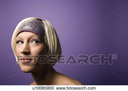 Head and shoulder portrait of bare young adult Caucasian blond woman on purple background wearing headband. View Large Photo Image Stock Image - Head and shoulder portrait of bare young adult Caucasian blond woman on purple background wearing headband.. Fotosearch