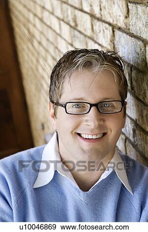 Caucasian adult male wearing glasses and smiling. View Large Photo Image Stock Photo - Caucasian adult male wearing glasses and smiling.. Fotosearch