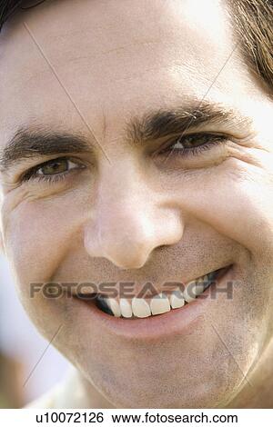 Close-up of Caucasian mid-adult male smiling at camera. View Large Photo Image Stock Photograph - Close-up of Caucasian mid-adult male smiling at camera.. Fotosearch