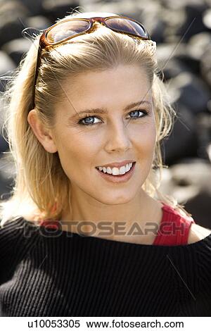 Stock Photography - Portrait of blonde Caucasian mid-adult woman smiling and looking at viewer.. Fotosearch