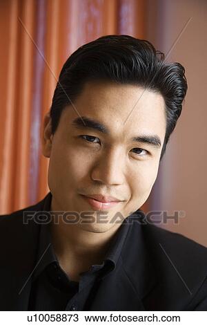 Stock Image - Prime adult Asian male portrait.. Fotosearch