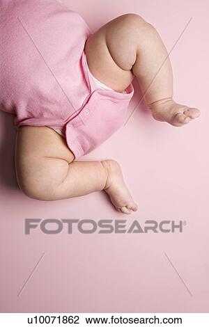 Stock Image - Close up of Asian babys chubby legs.. Fotosearch