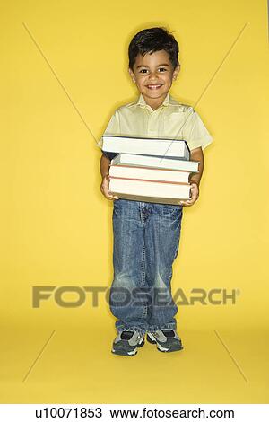 Filipino male child holding stack of books. View Large Photo Image Stock Image - Filipino male child holding stack of books.. Fotosearch
