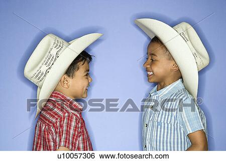 Hispanic and African American male child in cowboy hats. View Large Photo Image Stock Photograph - Hispanic and African American male child in cowboy hats.. Fotosearch