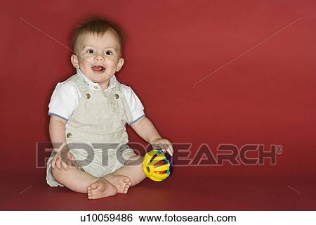 Portrait of Caucasian male child playing with ball. View Large Photo Image Stock Photograph - Portrait of Caucasian male child playing with ball.. Fotosearch