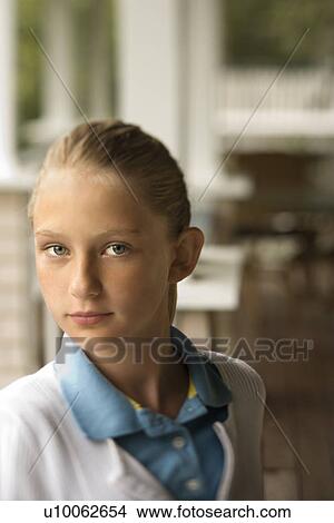 Picture - Portrait of Caucasian pre-teen girl looking at viewer.. Fotosearch