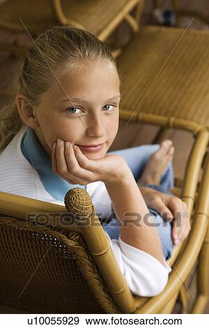 Portrait of Caucasian pre-teen girl with chin in hand looking at viewer. View Large Photo Image Stock Photo - Portrait of Caucasian pre-teen girl with chin in hand looking at viewer.. Fotosearch