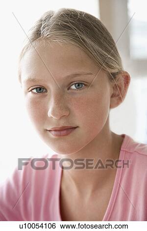 Stock Photograph - Portrait of Caucasian pre-teen girl looking at viewer. . Fotosearch