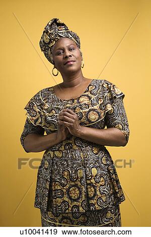 Stock Photo - African American female mature adult in African dress.. Fotosearch
