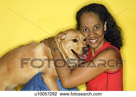 African American prime adult female petting dog. View Large Photo Image Stock Image - African American prime adult female petting dog.. Fotosearch