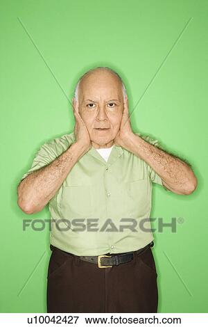 Caucasian mature adult male with hands over ears. View Large Photo Image Stock Photo - Caucasian mature adult male with hands over ears.. Fotosearch