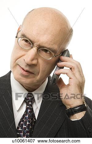 Caucasian middle-aged businessman on cellphone against white background. View Large Photo Image Stock Photo - Caucasian middle-aged businessman on cellphone against white background.. Fotosearch